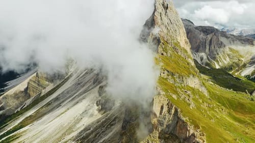 Heavy Clouds Hover Over Seceda Mountain Range in Alps