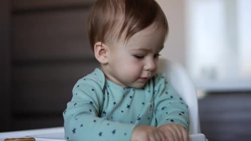Toddler Being Fed With a Spoon Indoors