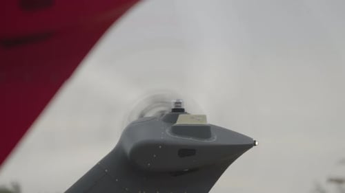 Aircraft Propeller Spinning in the Daytime, tail section view