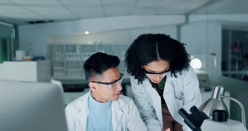 Scientists Studying Data in a Bright Laboratory