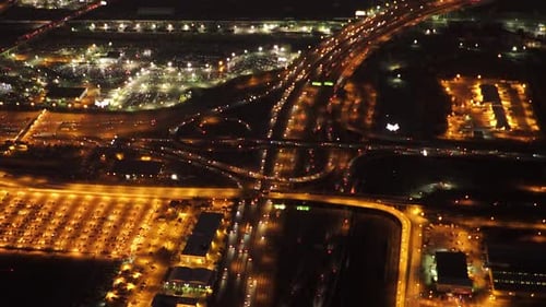 Aerial view of illuminated highway traffic road at night. cars driving freeway