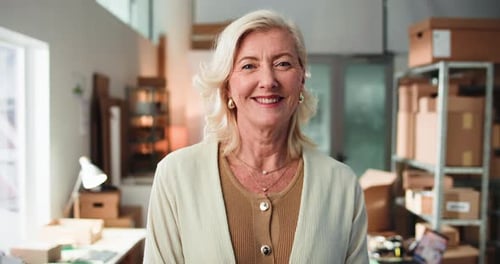 Smiling Woman in Office Setting, Looking at Camera