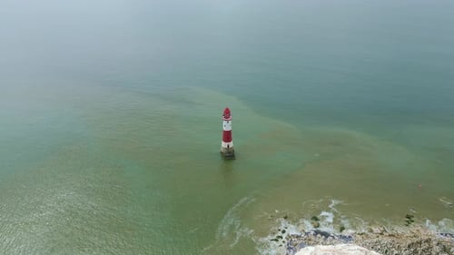 Revealing video of Beachy Head Lighthouse, white cliffs and sea taken by dji mini 3 pro drone in Eas