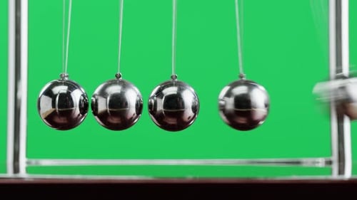 Newton Balls Closeup Five Metallic Pendulums on Green Chroma Key Background Cradle