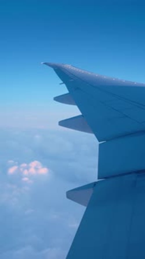 Stunning Vertical View From Airplane Window at Sunrise Sunset