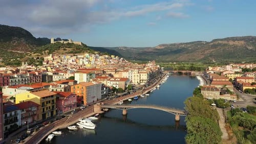 Aerial view of the beautiful village of Bosa with colored houses and a medieval castle. Bosa is loca