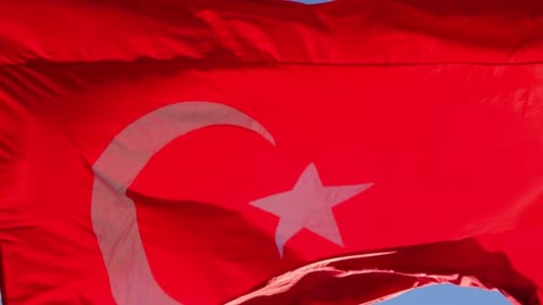 Turkish Flag Waving in Blue Sky