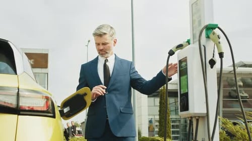 Charging Electric Car at Charging Station
