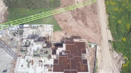 Large residential construction site with cranes, Aerial view