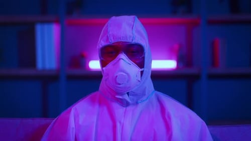 Individual in Hazmat Suit Gives Ok Hand Gestures