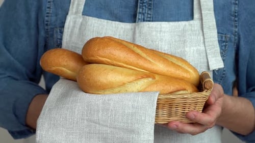 Baker Hands Hold Basket with Baked Bread French Baguette Bakery Food