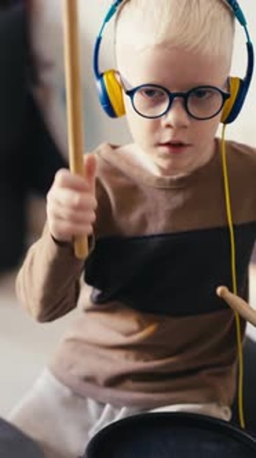 Child Plays Electronic Drums at Home