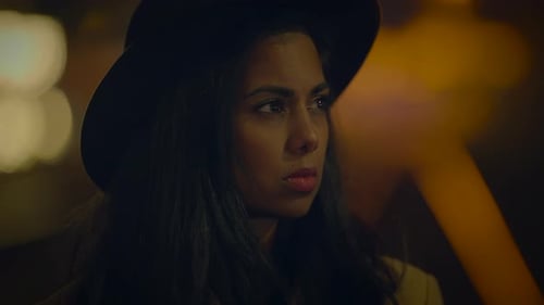 Stylish Woman Taking Photos at Night in City