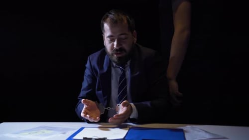Man in Handcuffs During Police Interrogation