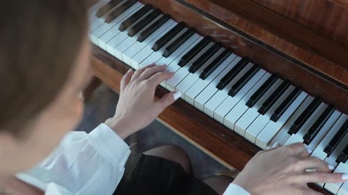 Elegant Hands Play Piano Keyboard Gracefully