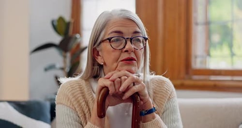 Senior Woman Resting Hands on Walking Cane