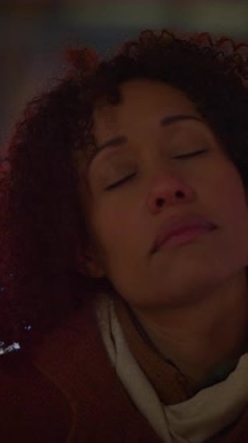 Woman with Curly Hair Contemplating at Night