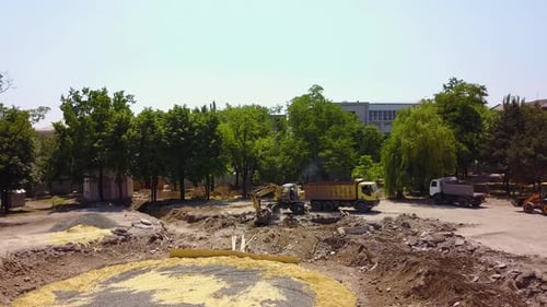 Excavation Site with Heavy Machinery in Urban Environment