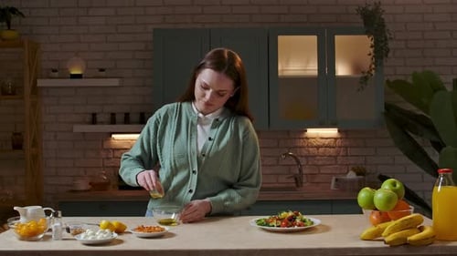 Woman Prepares Salad Dressing Ingredients in Kitchen