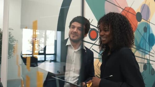 Colleagues Brainstorming Together in Modern Office