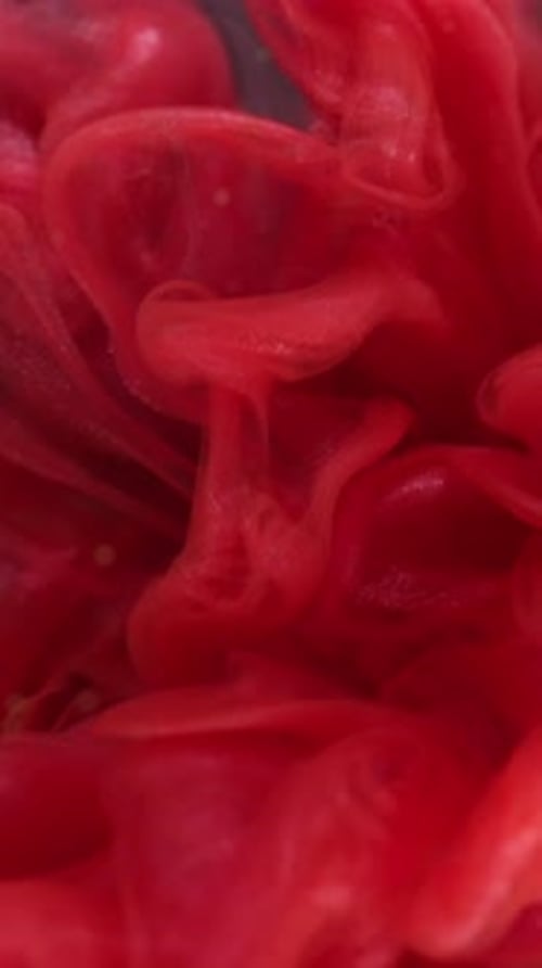 Abstract Red Ink Cloud Exploding Underwater Background