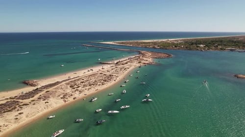 Aerial View of a Sandy Beach and Turquoise Ocean