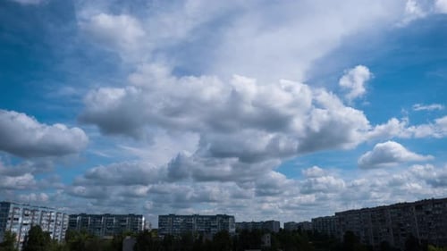 White Clouds Moving Across Blue Sky Time Lapse