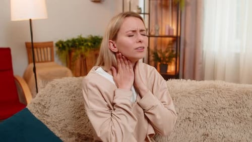 Woman Rubbing Neck Sore Throat Pain
