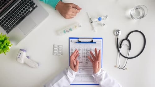 Doctor Consults with Patient During Office Visit