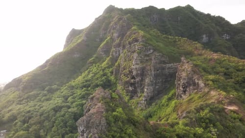 Slow rising view of the crouching lion on oahu