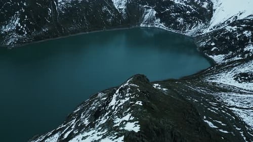 Aerial view of lake surrounded by mountains, Austria.