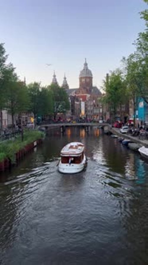 Vertical Boat On The Canal In Amsterdam