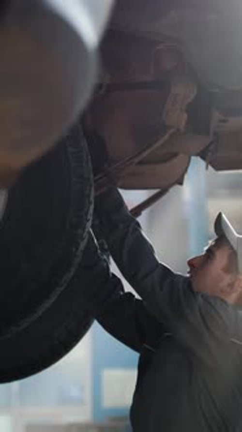 Car Automobile Service Mechanic Checks the Luxury SUV Slider Shot