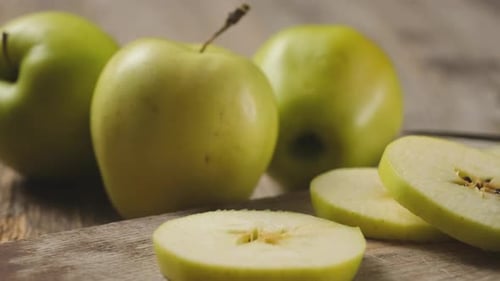Fresh Green Apples on Wooden Cutting Board