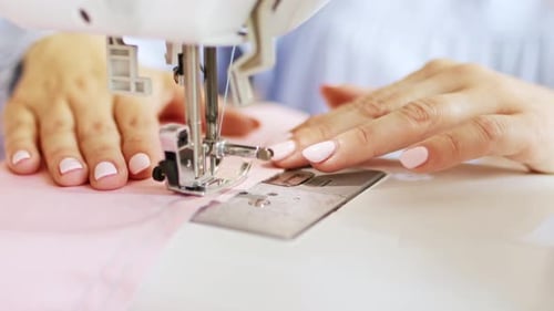 Sewing Machine Creating Pink Fabric at Home