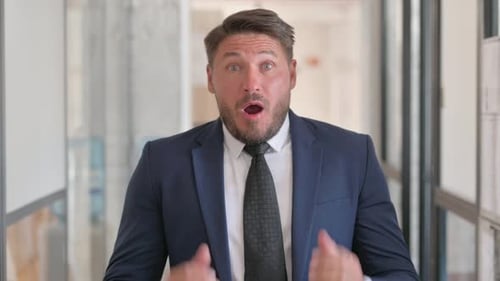 Man in Suit Reacts in Frustration