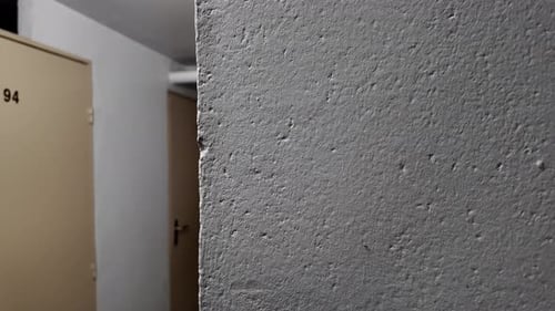 Corridor with storage unit doors dolly zoom out