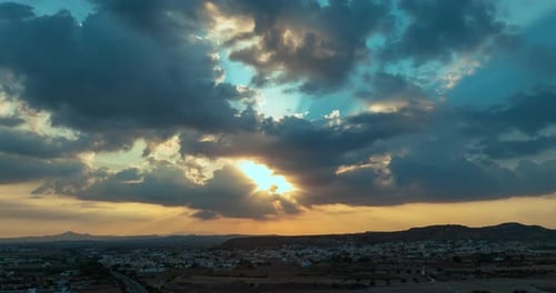 Aerial View Timelapse of the Sunset in the Mountain City