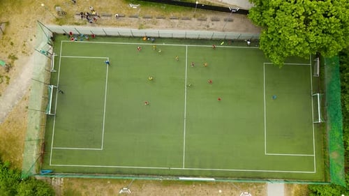 Top View Of A Football Pitch With Teams Playing During A Match. aerial, 4k