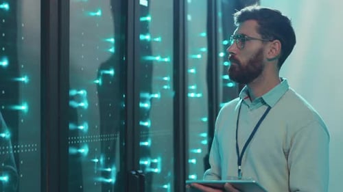 A Data Center Technician Monitors and Analyzes Server Performance Metrics Effectively