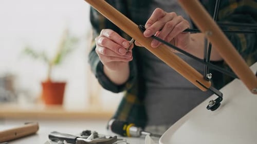 Assembling, Business Owner Assembles Quickly Prefabricated Furniture With Her Hands In Workshop