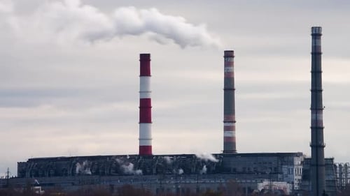 Smoke billowing from industrial chimneys