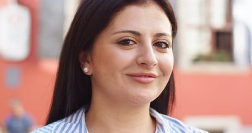 Beautiful Caucasian Woman Standing on Street and Looking to Camera Outdoors Portrait of Young Female