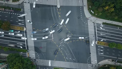 Timelapse of Cars and Pedestrians Moving at a Busy Intersection in Hangzhou China During the Daytime
