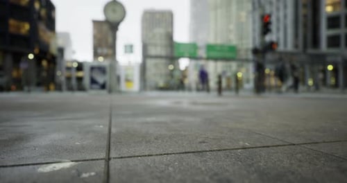 Crowded Urban Street Buzzing with Activity During a Rainy Afternoon