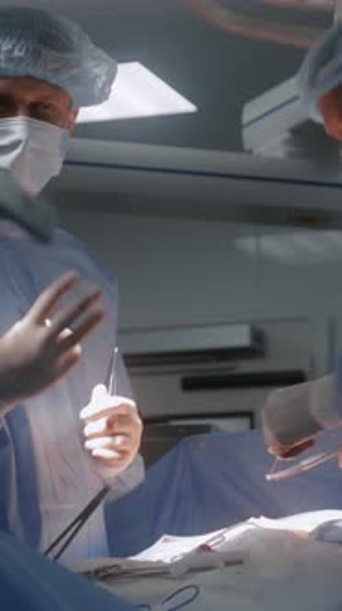 Surgeons Performing Operation in Hospital Operating Room