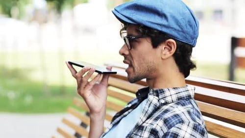 Young Man Using Voice Assistant on Mobile Device