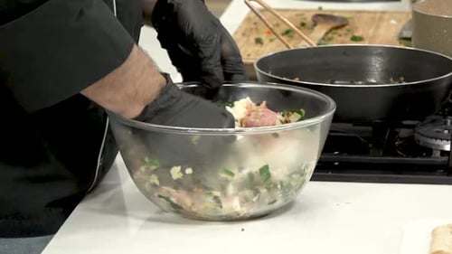 Close Up of Adult Mixing Ingredients in Bowl