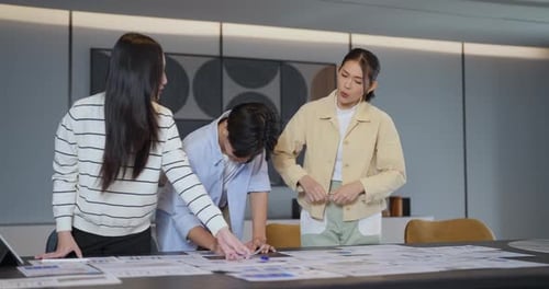 Team Collaborating on Business Strategy in Modern Office