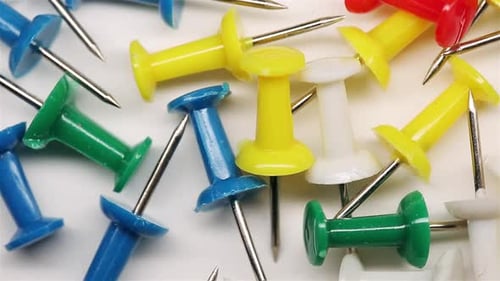Colorful Push Pins Rotating On The Desk.Drawing Pins For Marking On The Map Of The Earth Or City